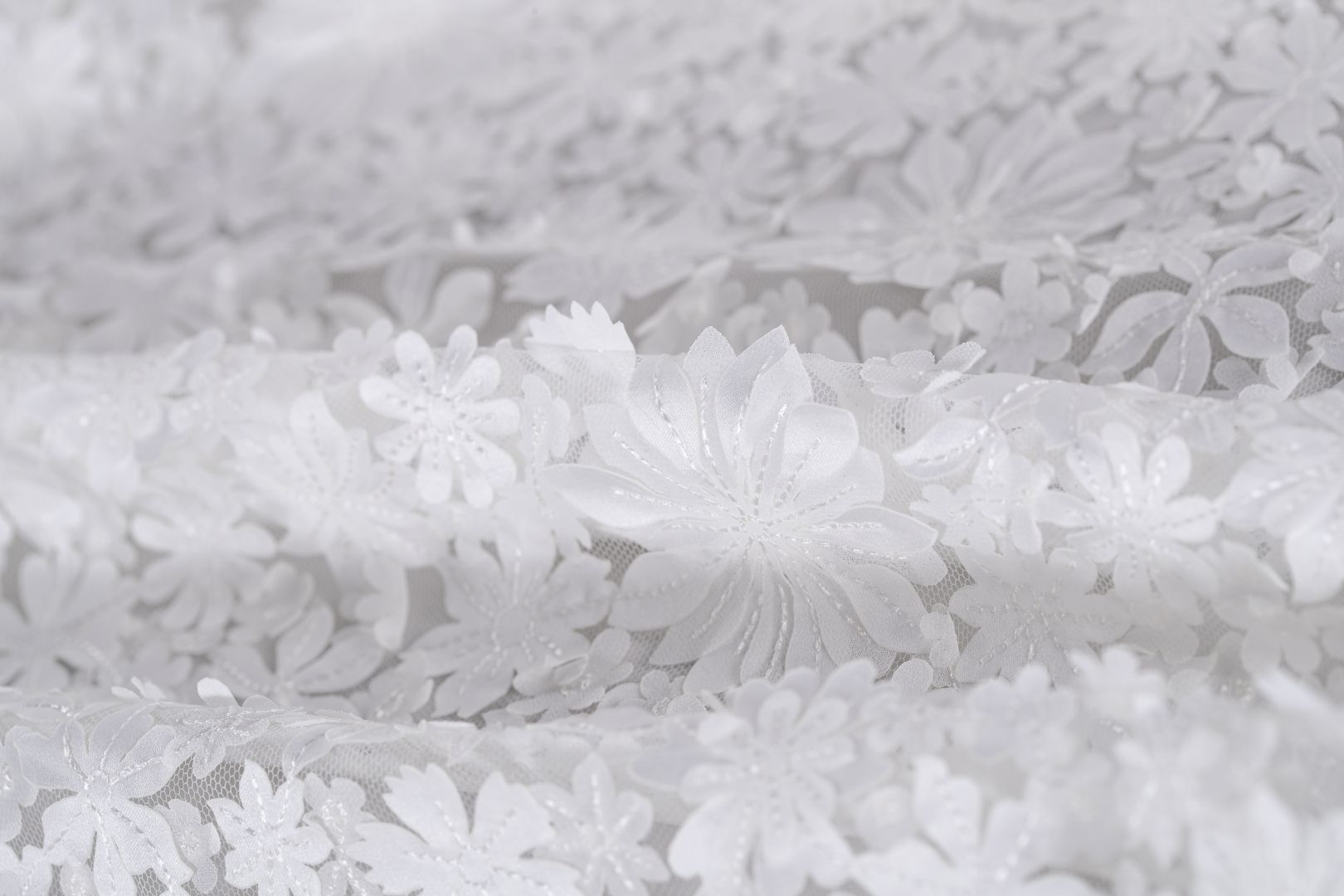 Magnificent white tulle with applied flowers new tess bridal fabrics